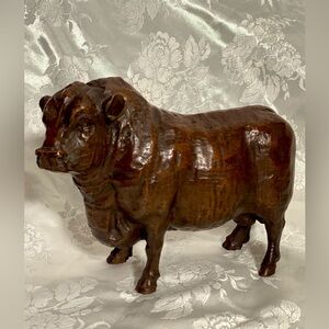 Hand-Carved Wood Figural Bull Statue 
Has A Rich, Dark Brown, Polished Finish